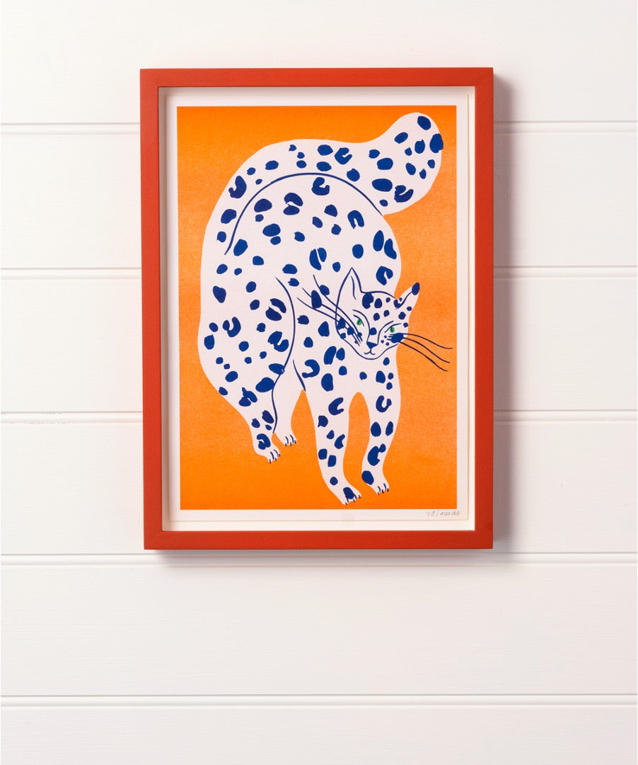 Blue Spotted Cat with Orange Background