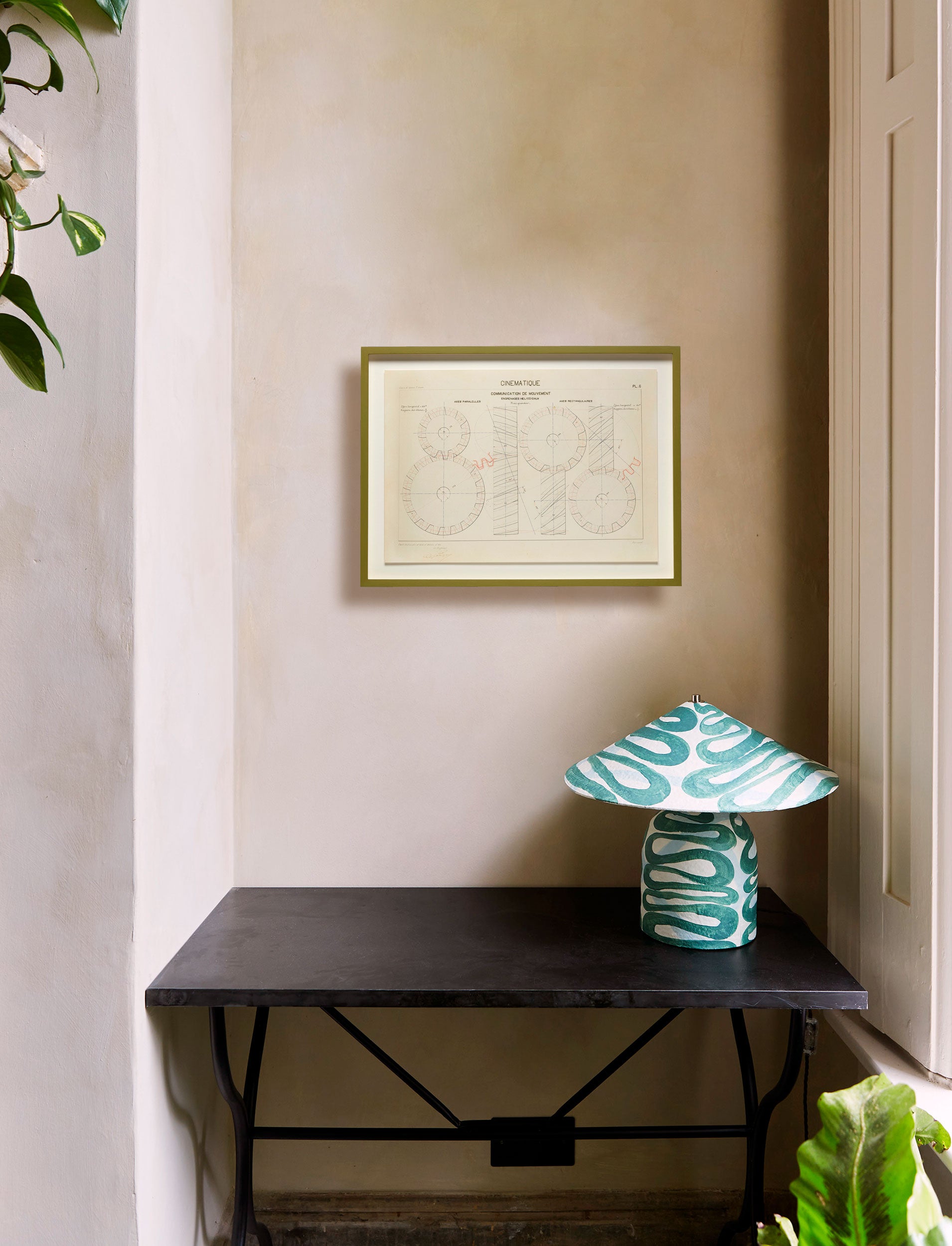 A print by G. Barraud of a technical drawing, float-mounted and framed in hand-painted olive green. Shows size in context of an interior setting.